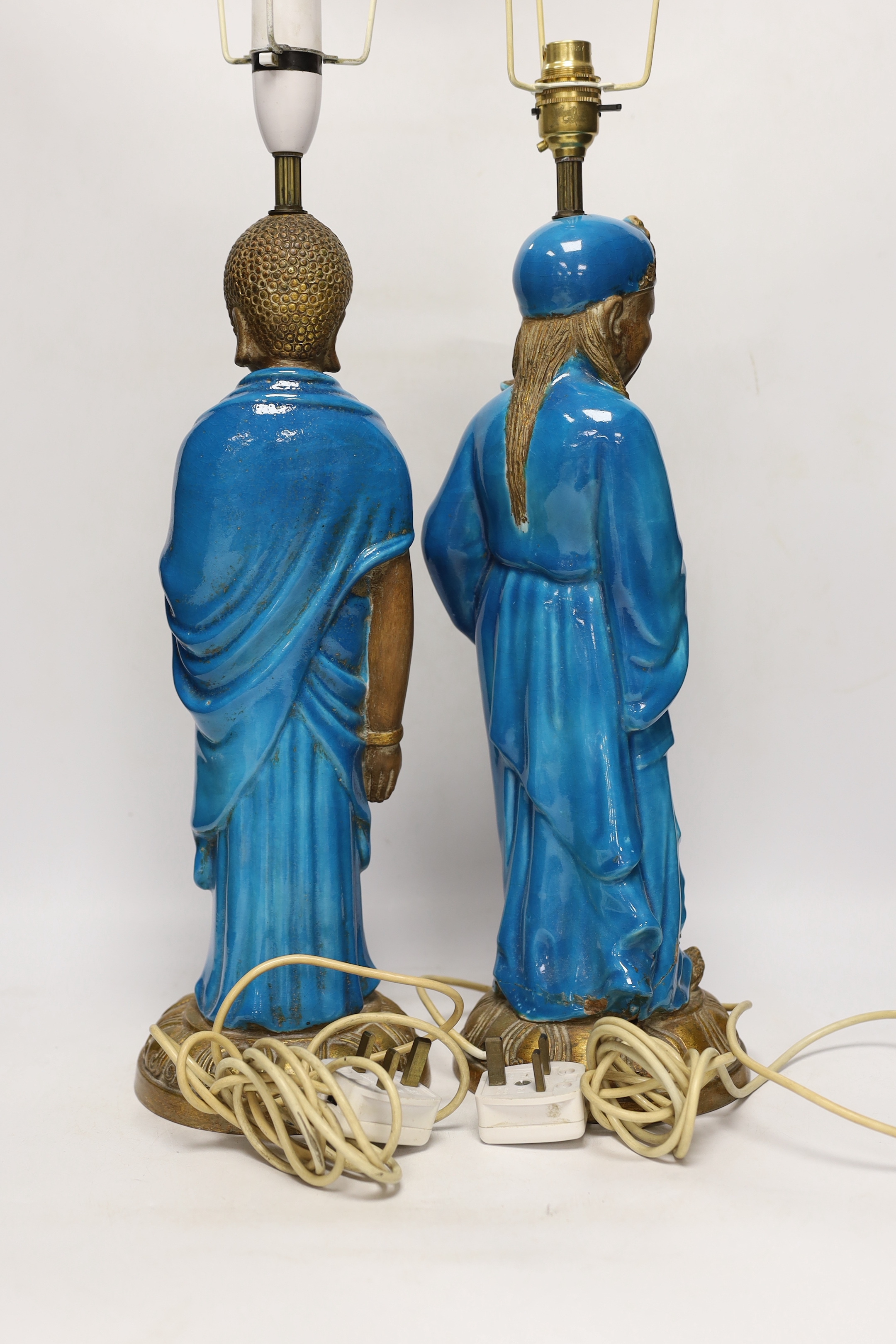 Two Chinese decoratively glazed and gilded pottery figures converted to lamp bases, approximately 44cm high